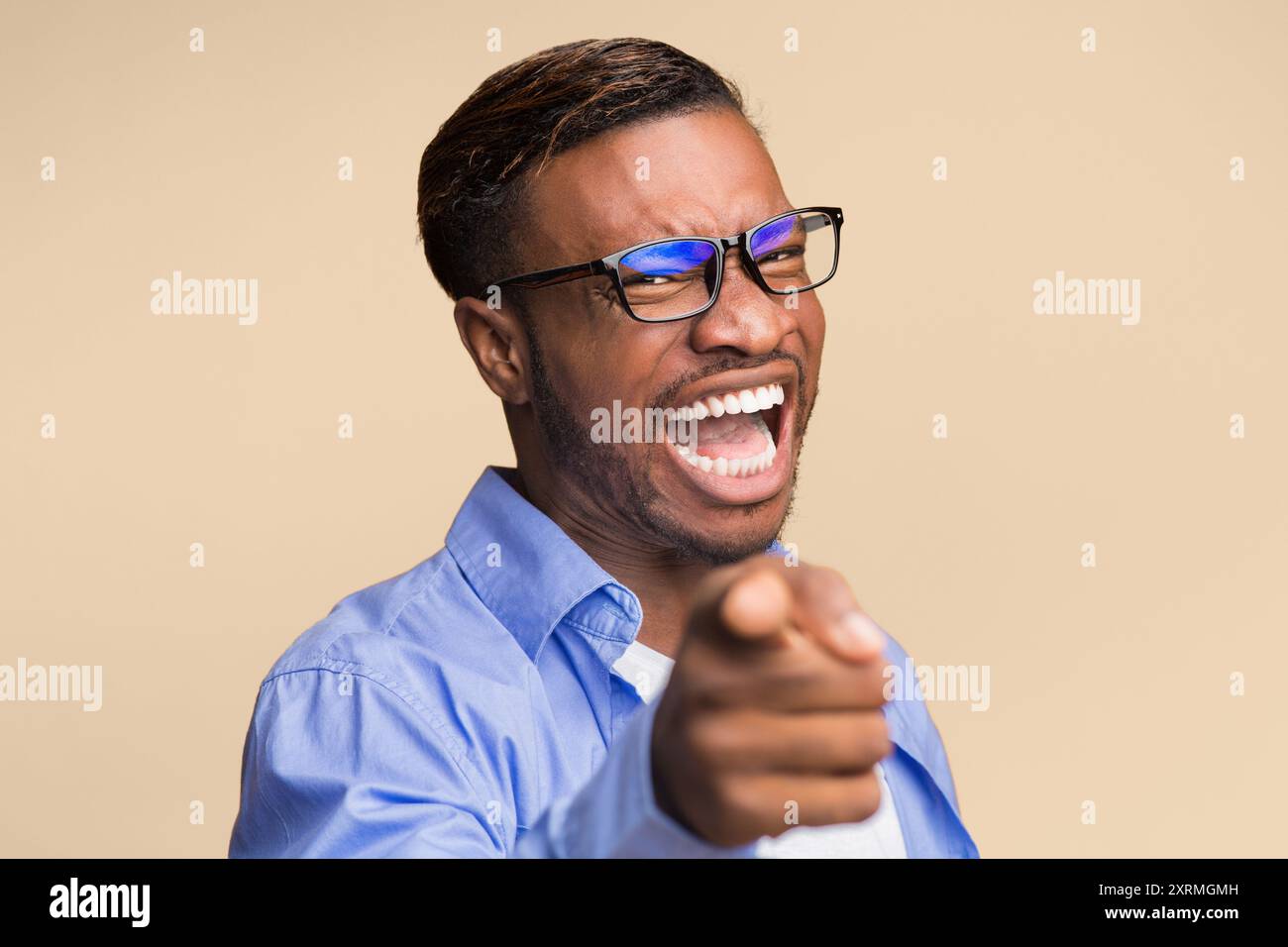 Man pointing finger laughing hi-res stock photography and images - Alamy
