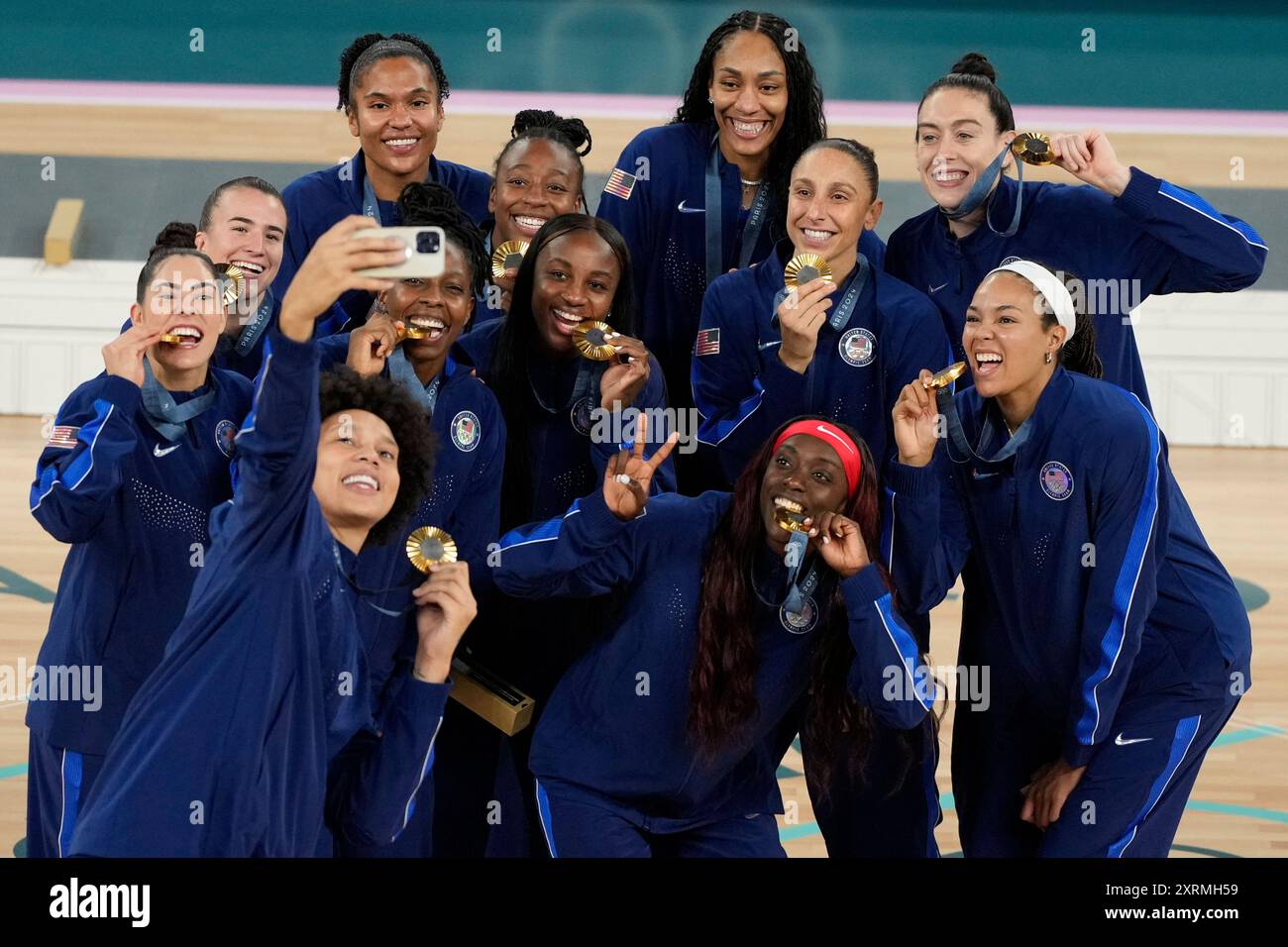 The United States team poses for a picture with their gold medals at ...