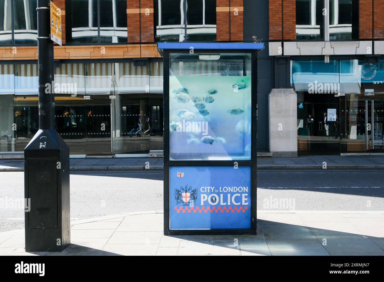 City of London, UK. 11th Aug 2024. 'Banksy' Piranha fish appear in City of London in a police box near St Paul's cathedral. Credit: Matthew Chattle/Alamy Live News Stock Photo