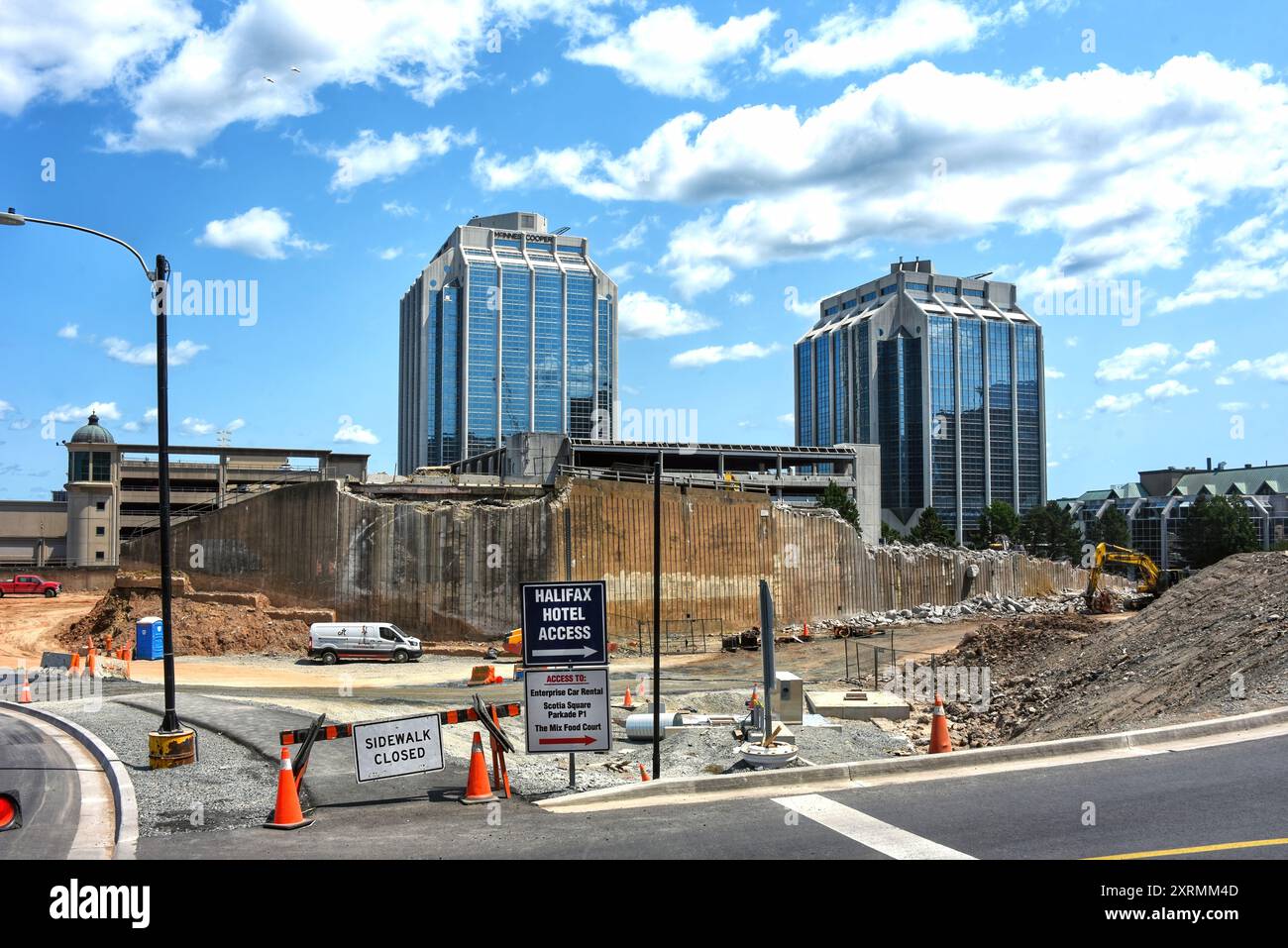 Halifax, Canada - July 22, 2024: Construction underway on the Cogswell District Redevelopment Project in downtown Halifax. The towers of Purdy’s Wharf Stock Photo