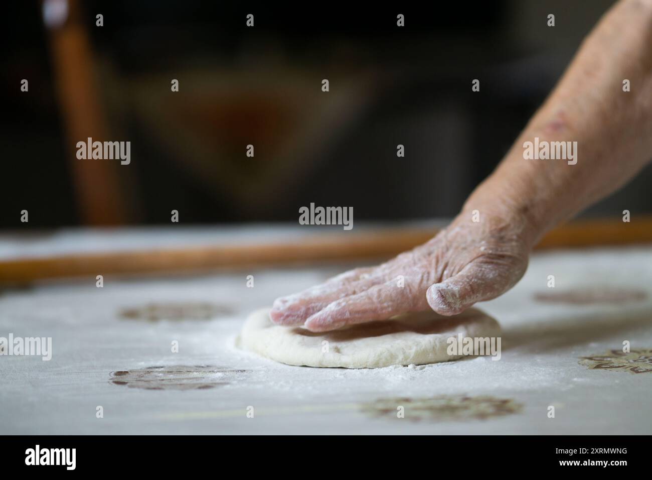 Old woman hand kneading dough Stock Photo - Alamy