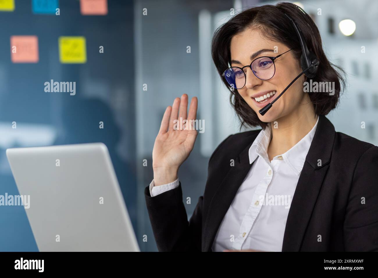 Friendly female customer service representative with headset and ...