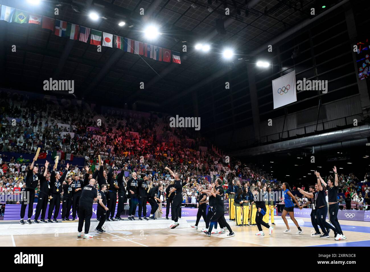 Paris, France. 11th Aug, 2024. Italian players and staff celebrate during the medal ceremony at the end of the Volleyball gold medal match between United States of America and Italy of the Paris 2024 Olympic Games at Arena Paris Sud 1 in Paris (France), August 11, 2024. Italy defeated United States 3-0 and won the gold medal. Credit: Insidefoto di andrea staccioli/Alamy Live News Stock Photo