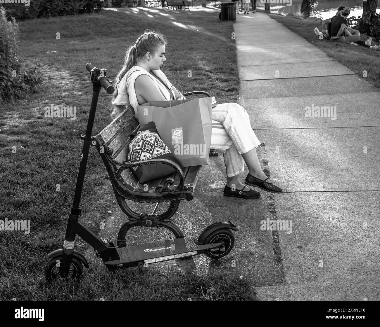 One way to get around a city is with a scooter. No gas, no electronics, just get on and push with your legs. Also girls it great for the hips and legs Stock Photo