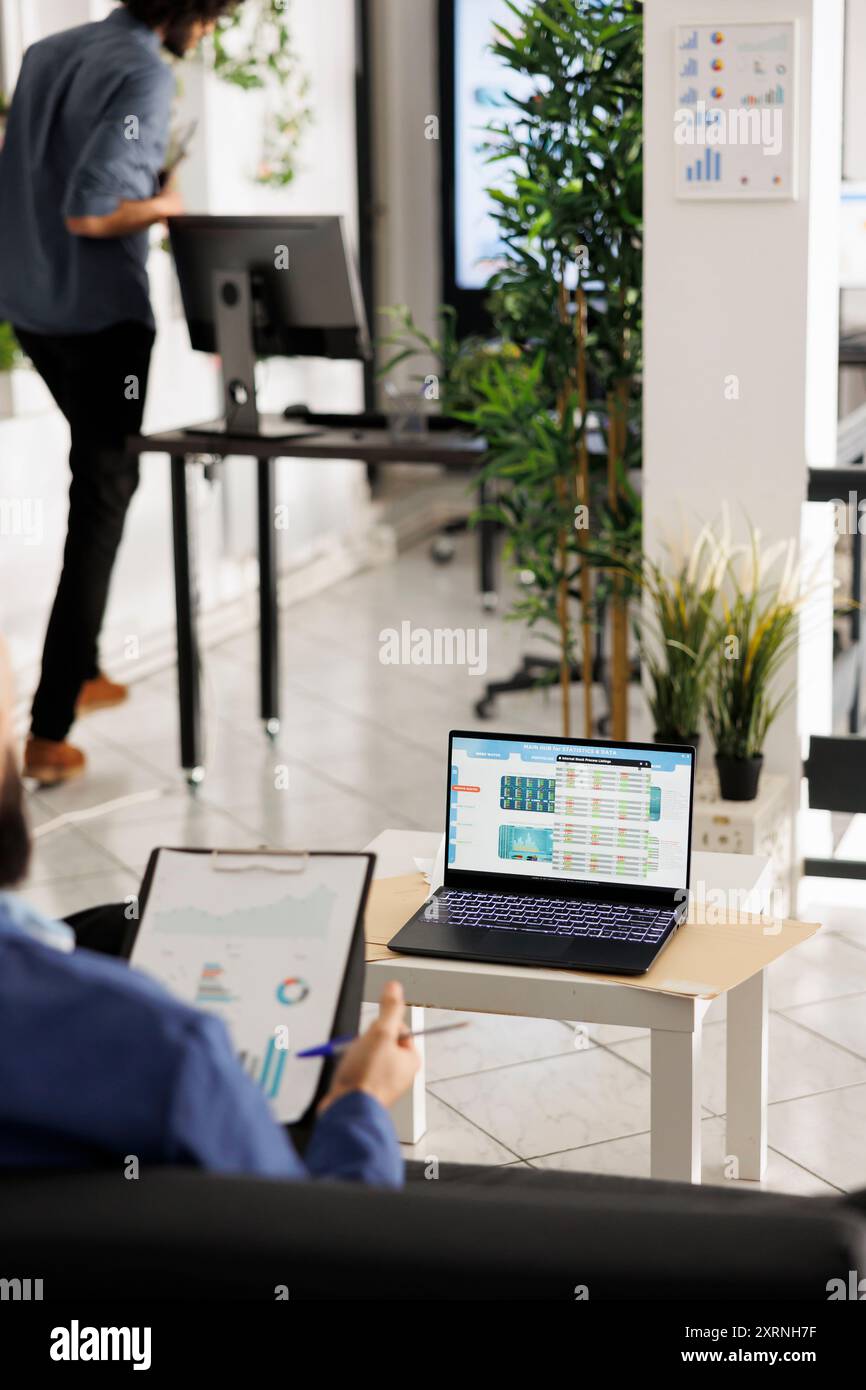 Startup worker analyzing statistics diagrams hi-res stock photography ...