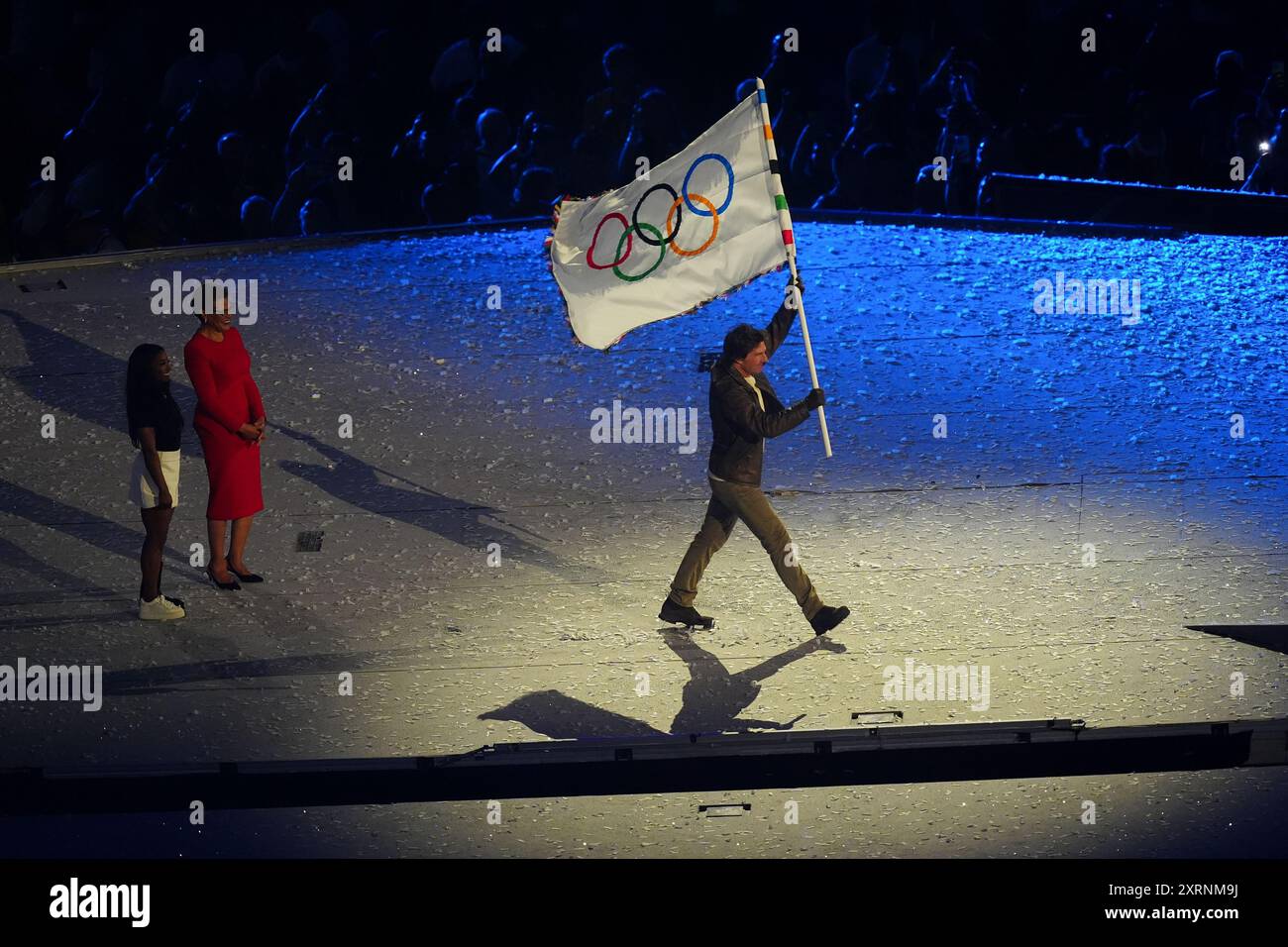 Tom Cruise with the Olympic Flag during the closing ceremony of the