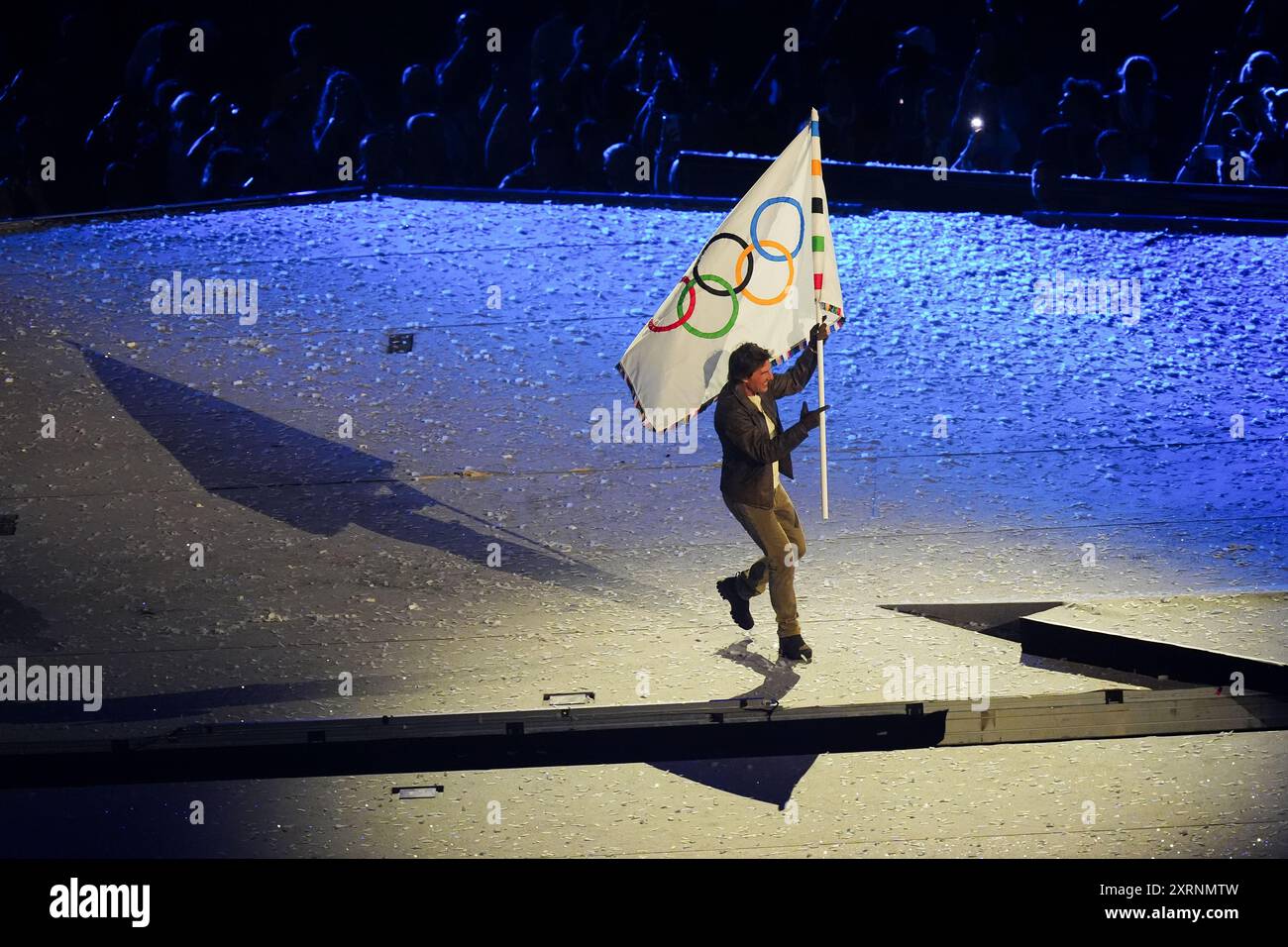 Tom Cruise with the Olympic Flag during the closing ceremony of the