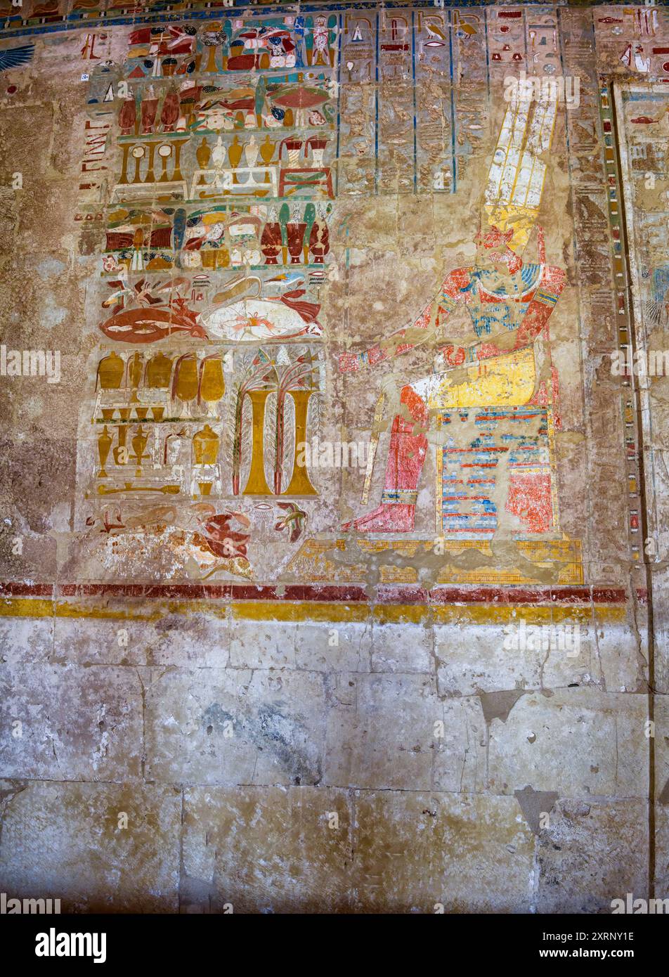 Amun patron deity of Thebes, seated before a table of offerings in the Chapel of Anubis at Hatshepsut's Mortuary Temple Stock Photo