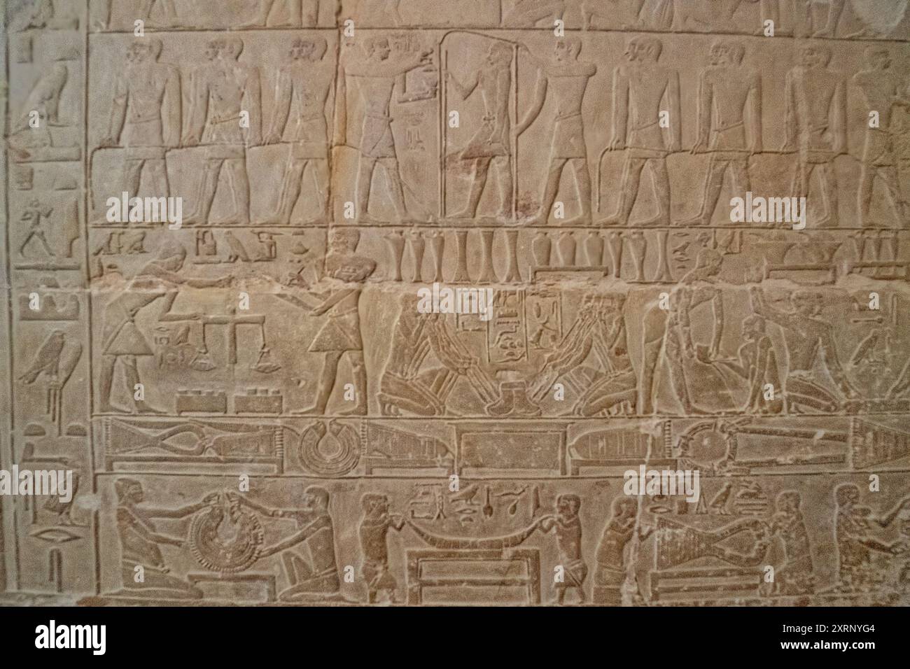 Two registers from Mereruka's tomb showing craftsmen weighing and smelting gold ore and the production of collars and pectorals. Stock Photo