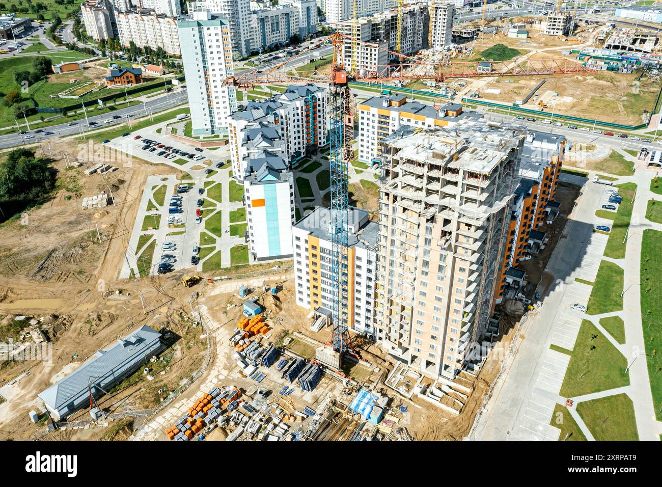 new high-rise modern apartment building under construction. aerial view of city construction site. Stock Photo