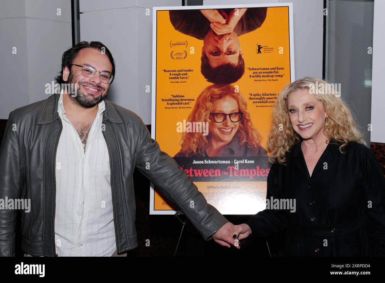 Los Angeles, USA. 11th Aug, 2024. Director - Nathan Silver and legendary actress Carol Kane in front of their comedy movie poster, 'Between the Temples.' Screening held at the Museum of Tolerance, Los Angeles, CA. Credit: Todd Felderstein/Alamy Live News Stock Photo