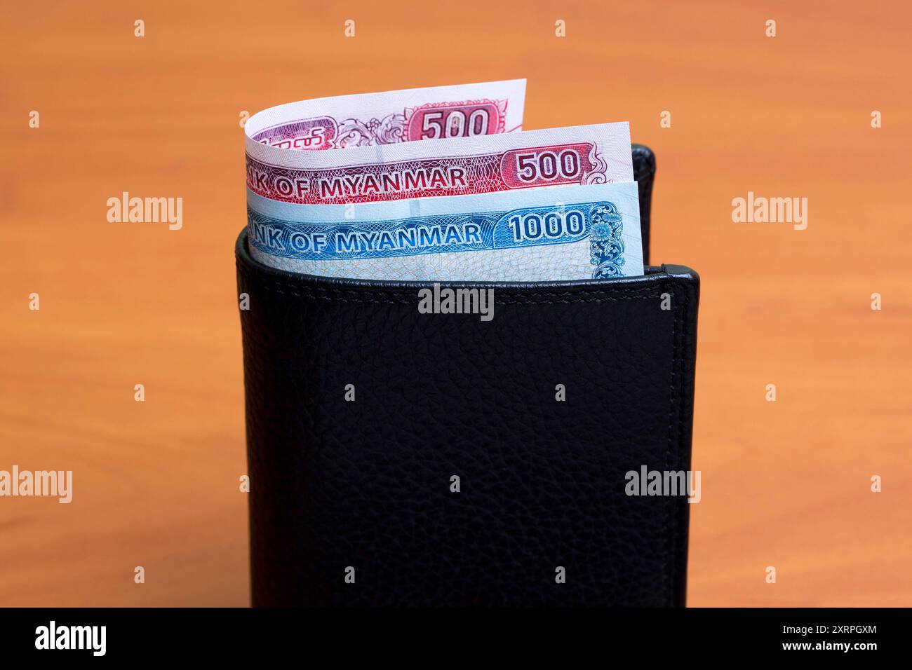 Myanmar money - Kyat in the black wallet Stock Photo