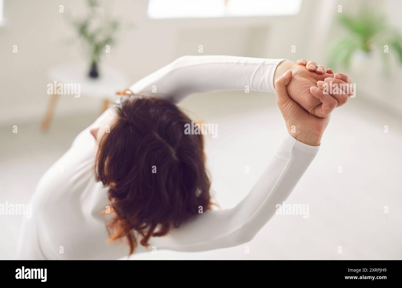 Yogi woman stretching hands hi-res stock photography and images - Alamy
