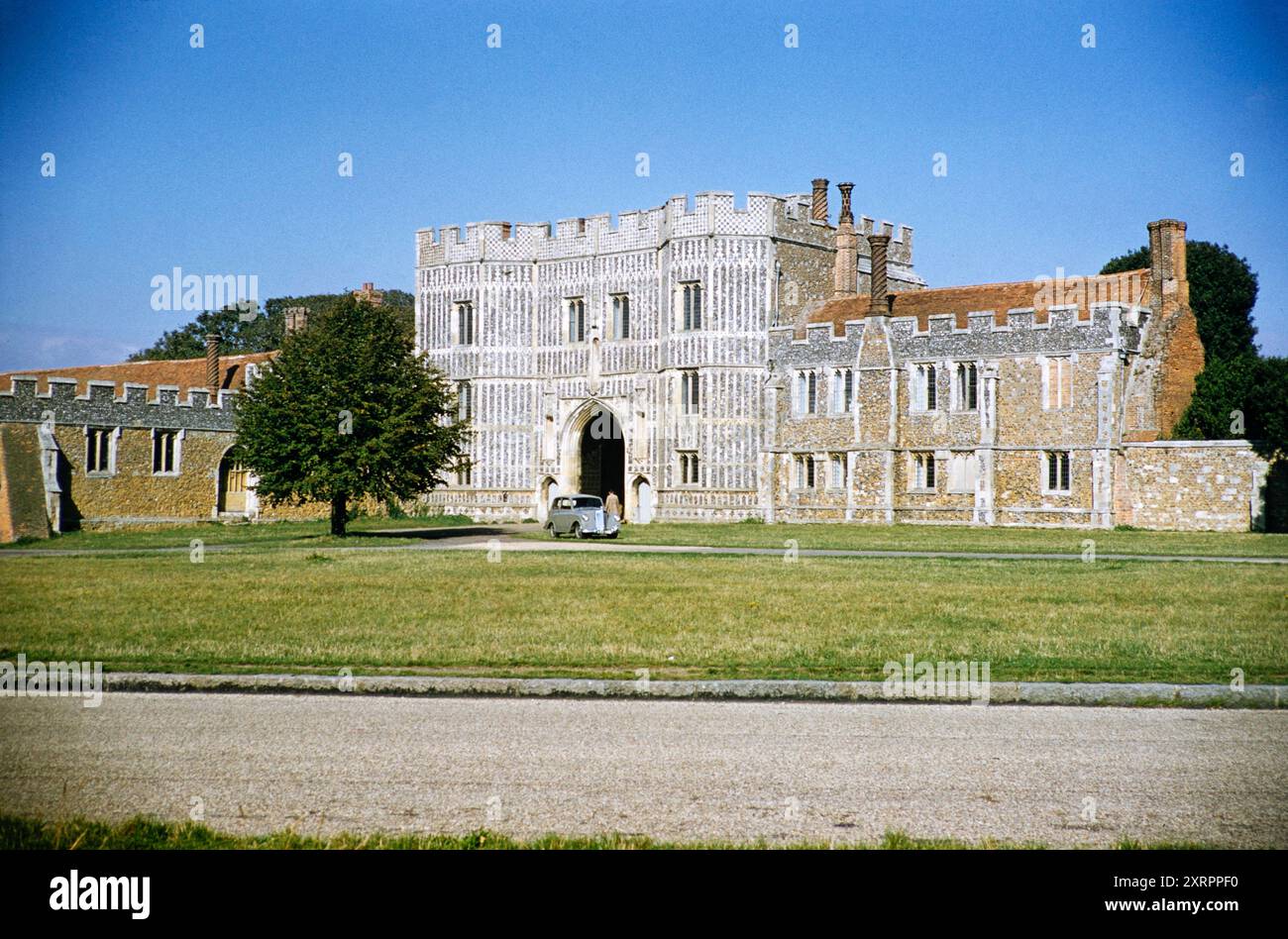 Gatehouse of St Osyth priory, Essex, England, UK 1956 Triumph Mayflower car parked outside Stock Photo