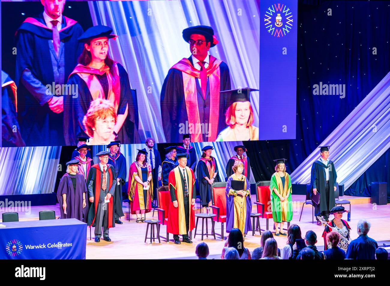 Graduation ceremony at the Butterworth Hall, Warwick University. The academics and Presiding Officer on stage before the awards ceremony begins. Stock Photo