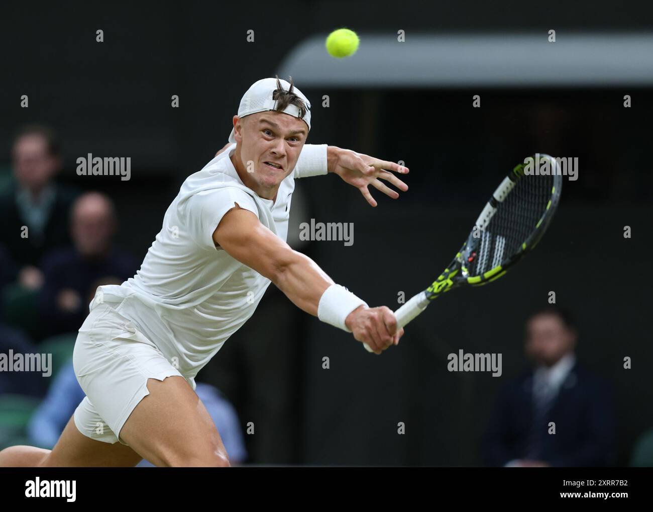 Danish tennis player Holger Rune in action at the 2024 Wimbledon ...