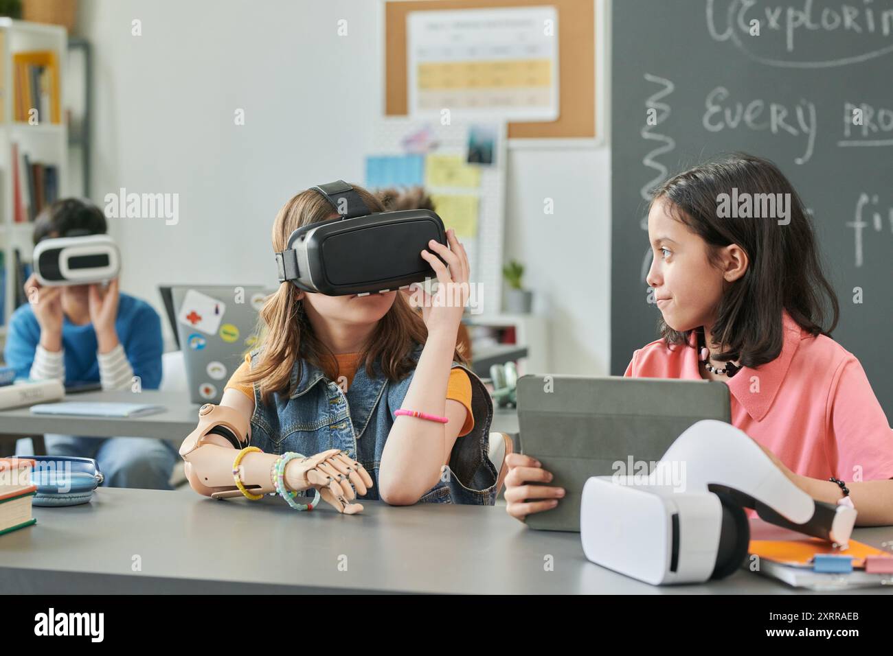 Girls using Virtual Reality Technology in School Stock Photo