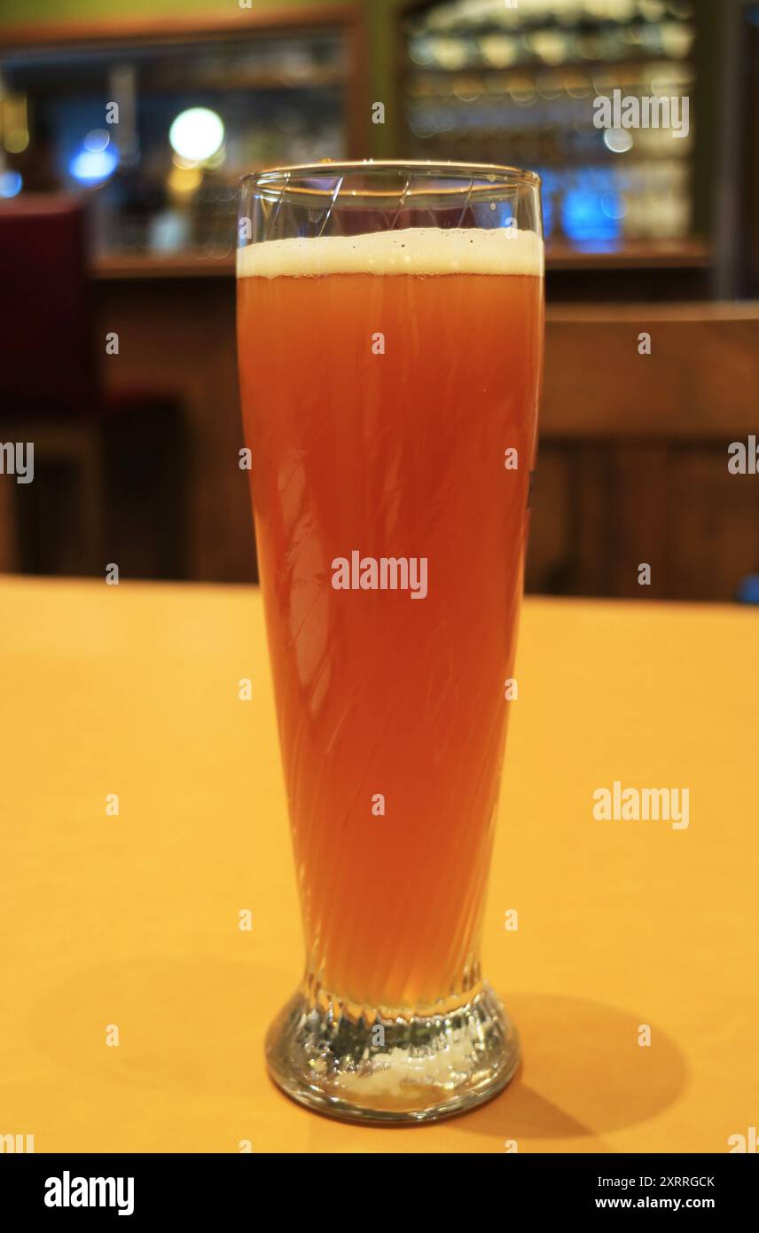 Glass of Hefeweizen, a German Wheat Beer Isolated on the Table Stock Photo