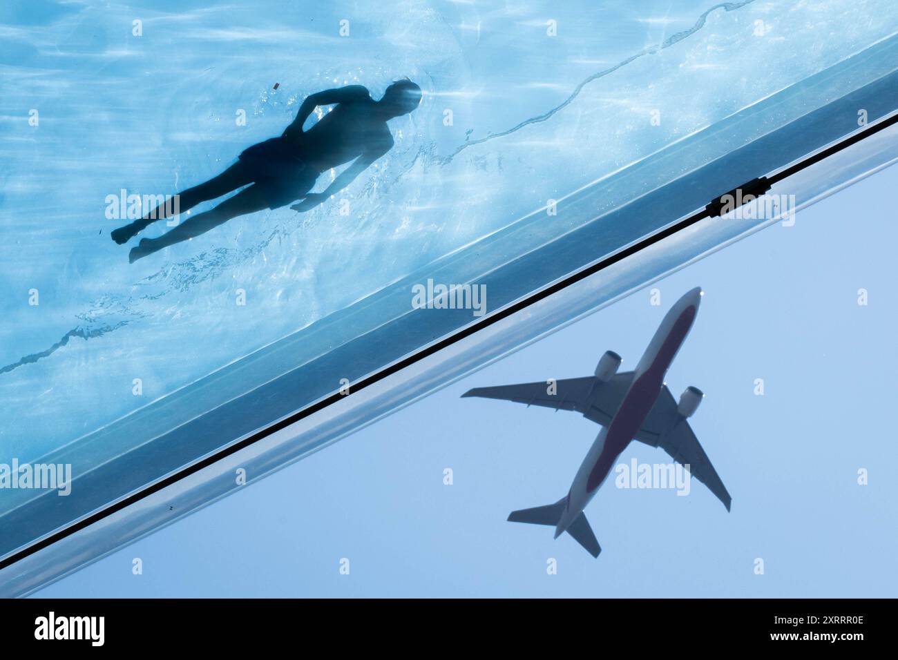 Swimmers in the Sky Pool, a transparent swimming pool suspended 35 ...