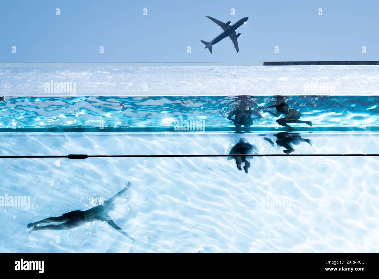 Swimmers in the Sky Pool, a transparent swimming pool suspended 35 ...