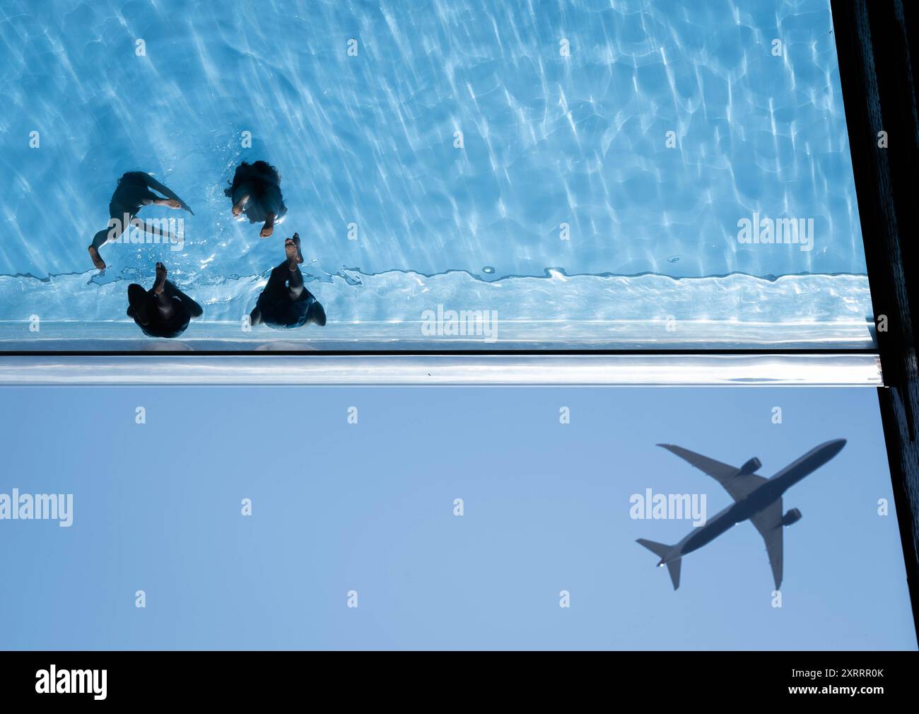 Swimmers in the Sky Pool, a transparent swimming pool suspended 35 ...