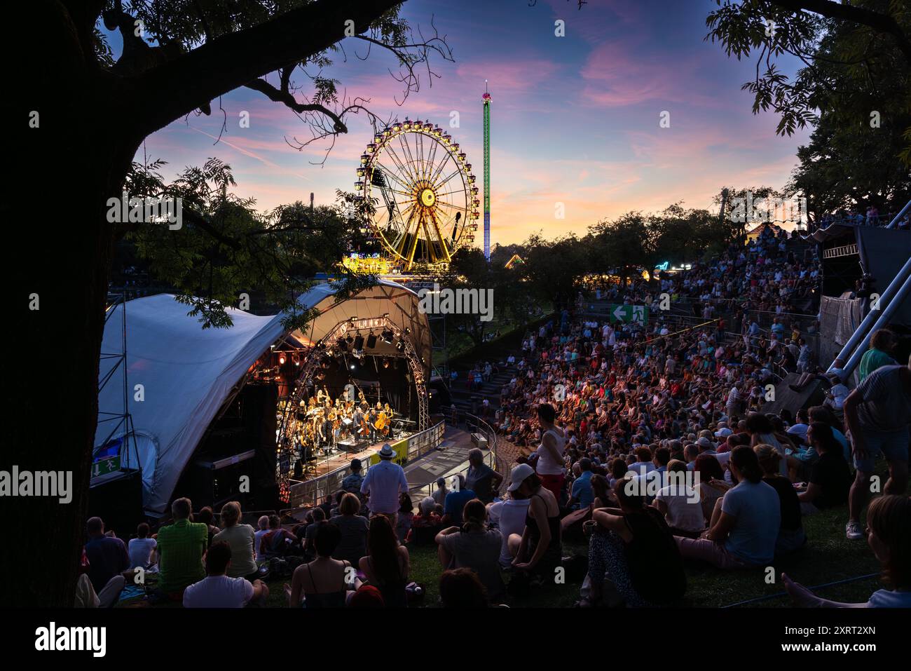 August 11, 2024 - Munich, GERMANY: Bands are playing for free in 'Music Summer' in the amphitheater like Theatron venue, here the classic Orchestra 'S Stock Photo