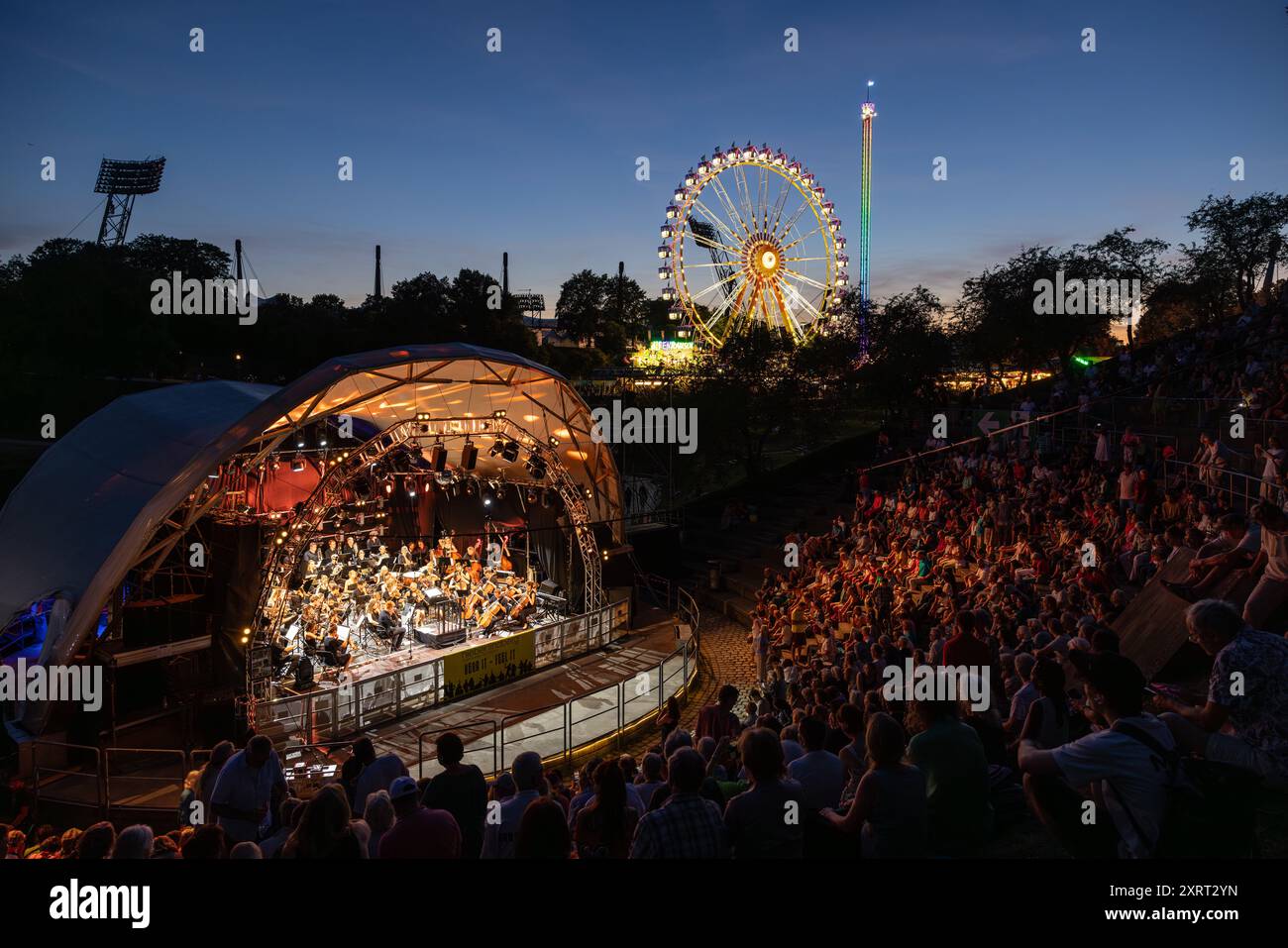 August 11, 2024 - Munich, GERMANY: Bands are playing for free in 'Music Summer' in the amphitheater like Theatron venue, here the classic Orchestra 'S Stock Photo