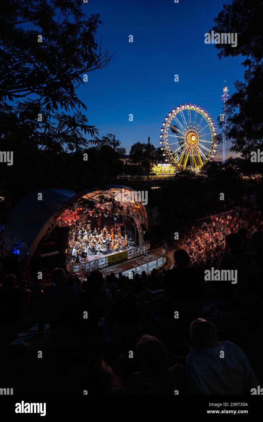 August 11, 2024 - Munich, GERMANY: Bands are playing for free in 'Music Summer' in the amphitheater like Theatron venue, here the classic Orchestra 'S Stock Photo