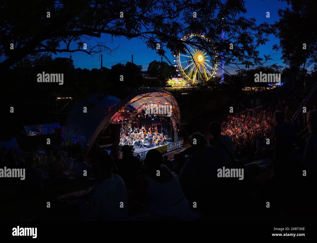 August 11, 2024 - Munich, GERMANY: Bands are playing for free in 'Music Summer' in the amphitheater like Theatron venue, here the classic Orchestra 'S Stock Photo