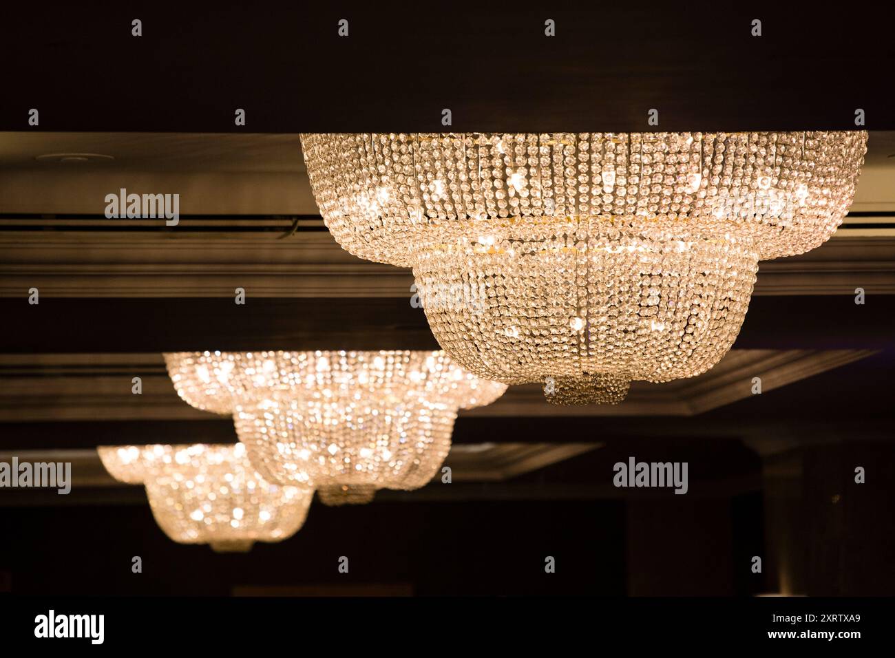 Large chandelier hanging from ceiling hi-res stock photography and ...