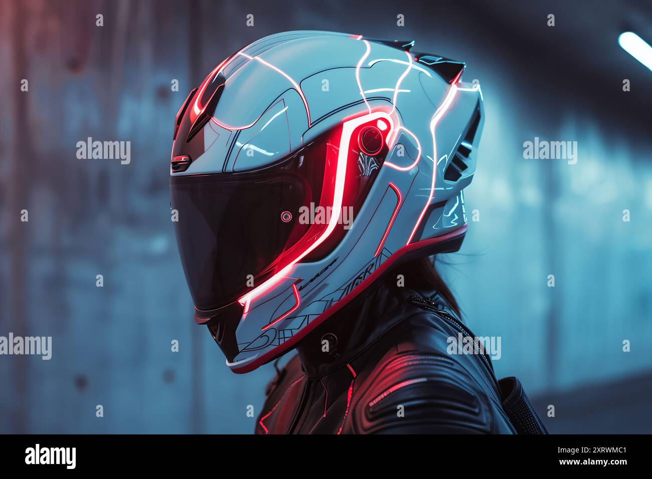 Futuristic biker wearing a high-tech helmet safety by protecting the rider's head on urban street Stock Photo