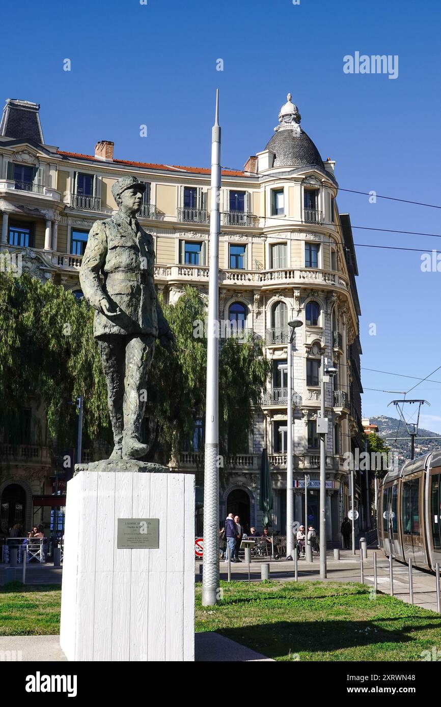 Statue du Général de Gaulle, statue of Charles de Gaulle at Place Charles de Gaulle, Nice, France, with people, the tram and apartment building. Stock Photo