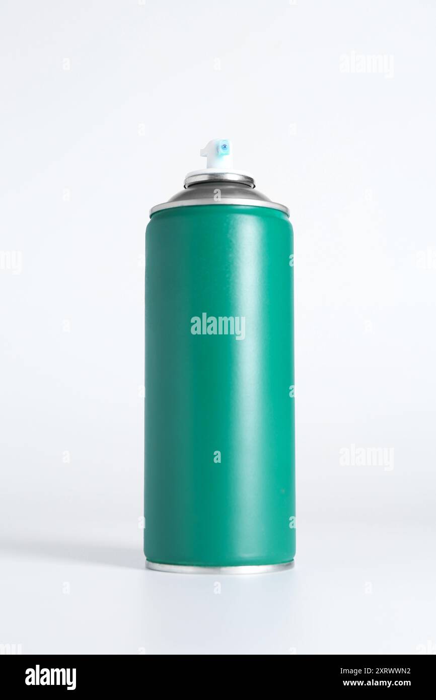 Can of spray paint on white background Stock Photo - Alamy