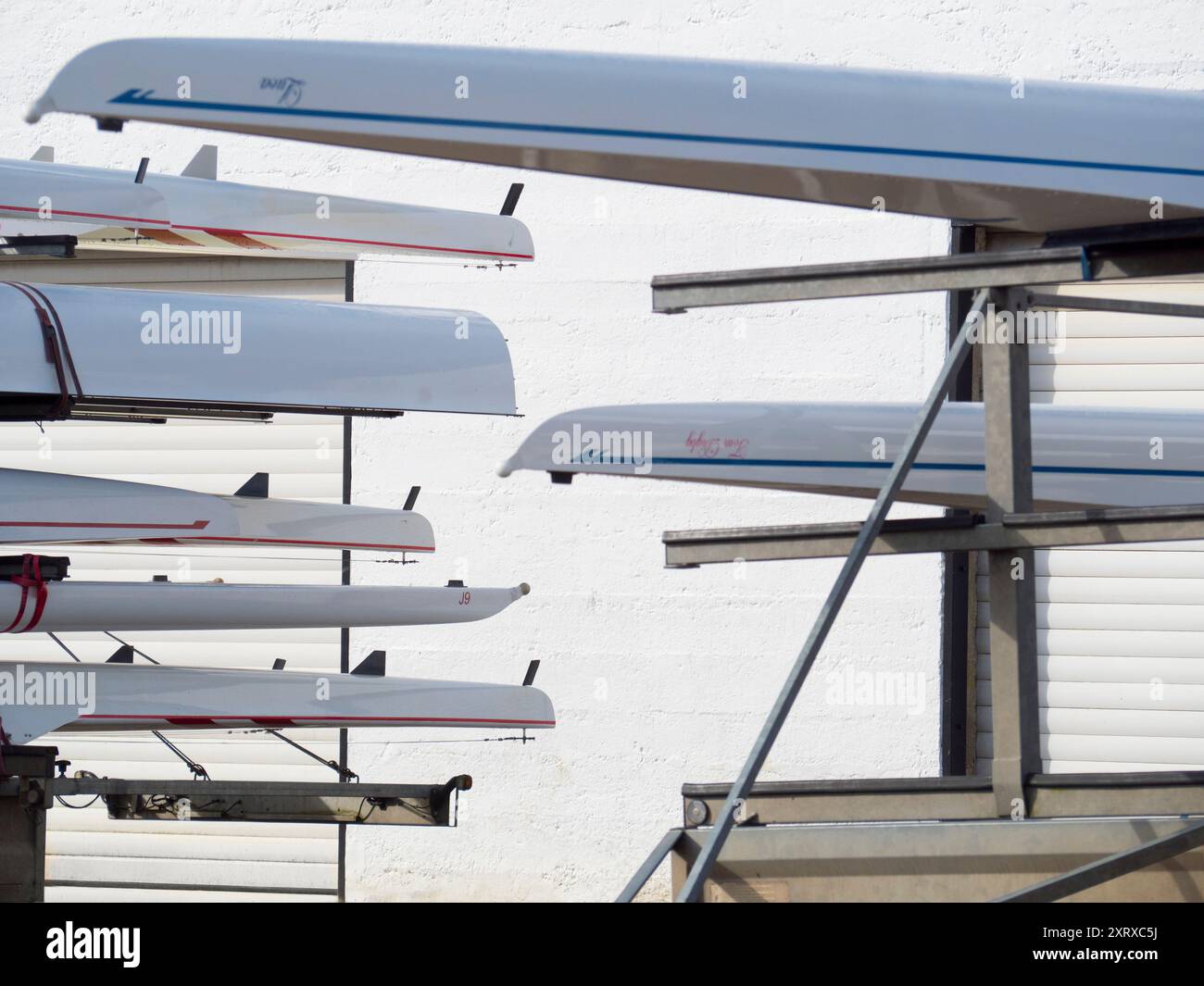 Local Rowing Boathouse Racked sculls outside Radley boathouse by the Thames create these ...