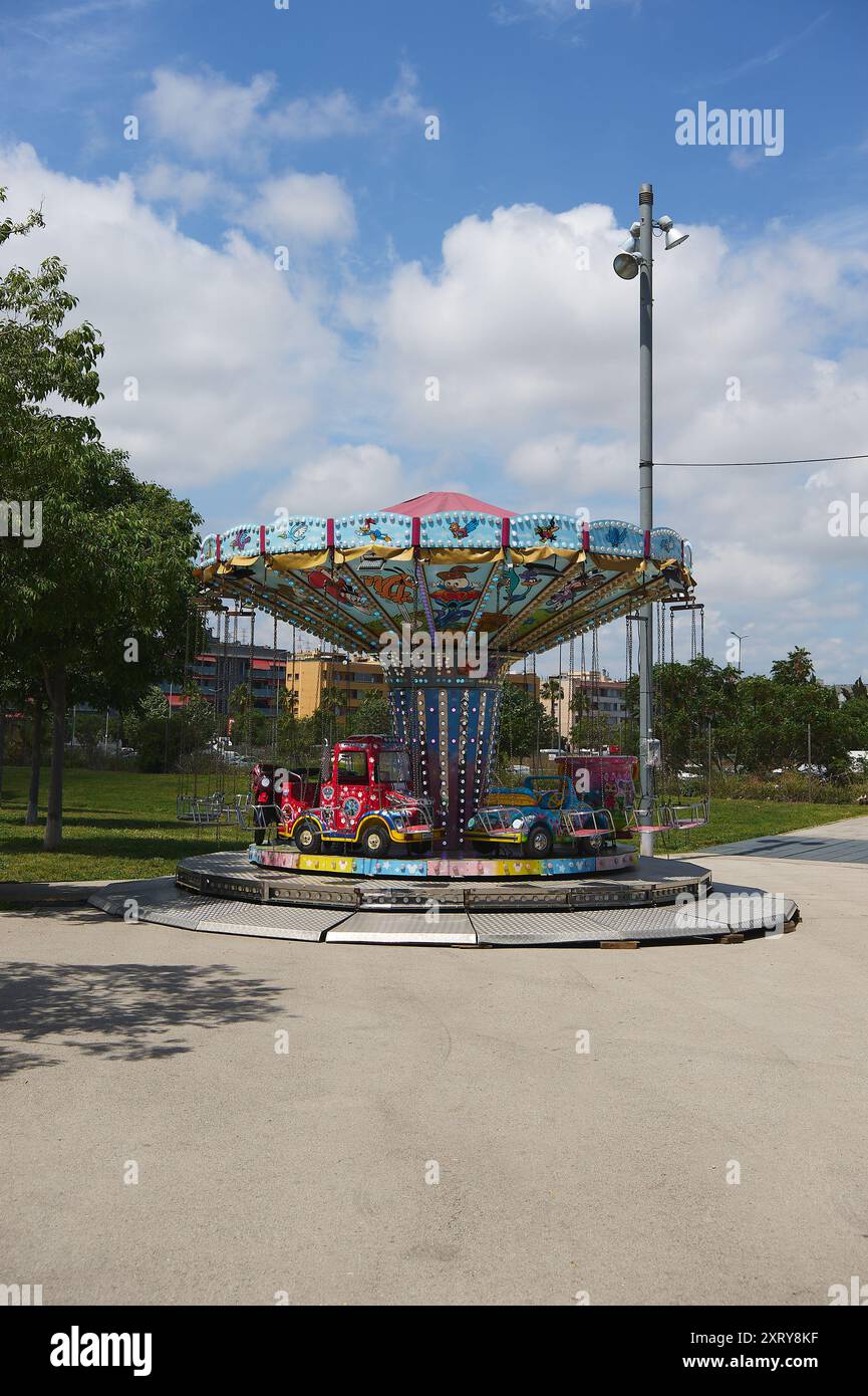 Viladecasn, SPAIN - AUGUST 12, 2024: Colorful children's carousel in a ...