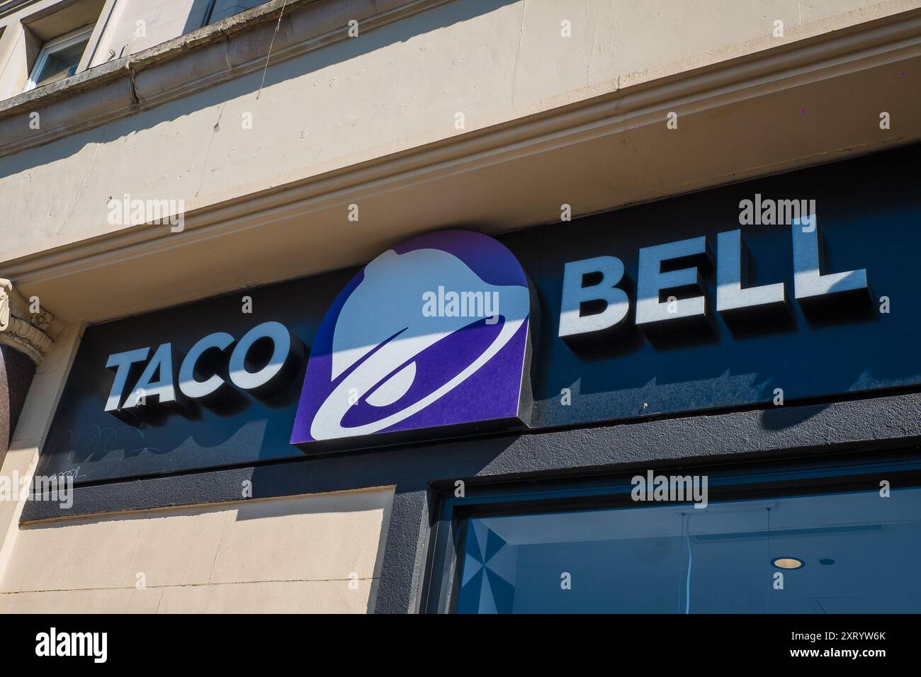 London, UK - July 22, 2024: Taco Bell fast food restaurant logo sign at entrance. Stock Photo