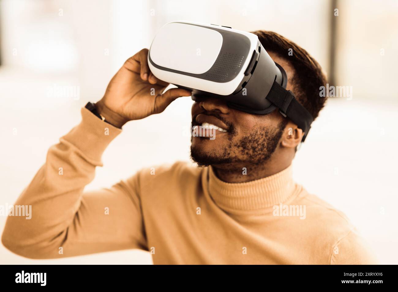 Afro manager wearing augmented reality goggles at office Stock Photo