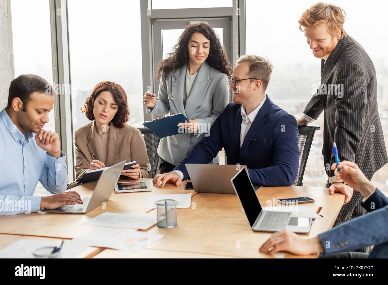 Professionals working together in modern hi-res stock photography and ...