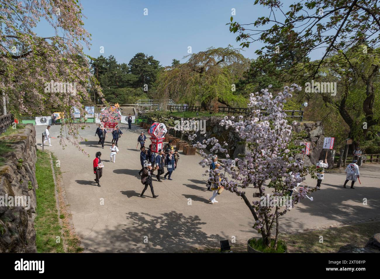 Festival parade at Hirosaki Castle and gardens during the 2024 Cherry Blossom Festival Stock Photo
