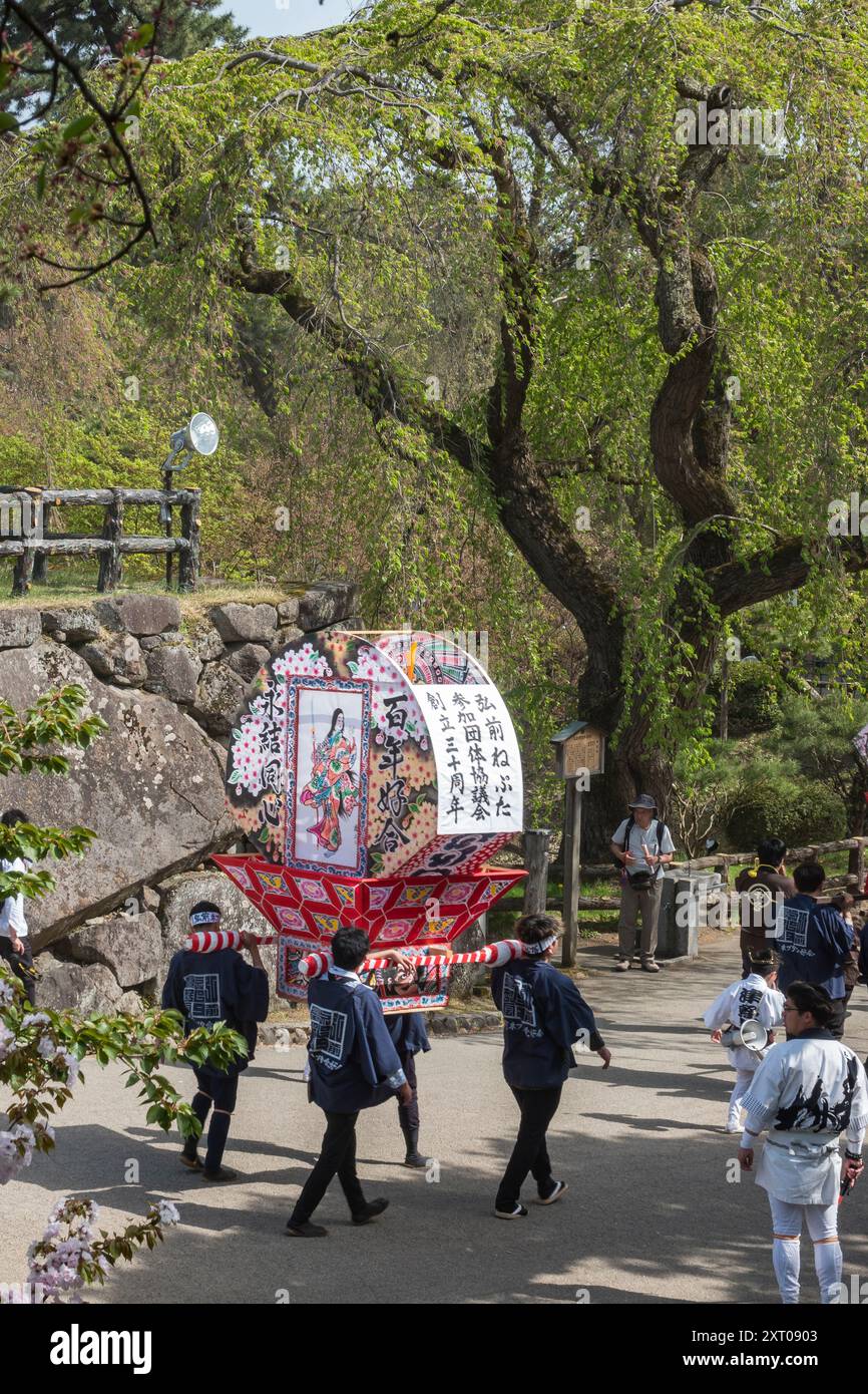 Festival parade at Hirosaki Castle and gardens during the 2024 Cherry Blossom Festival Stock Photo