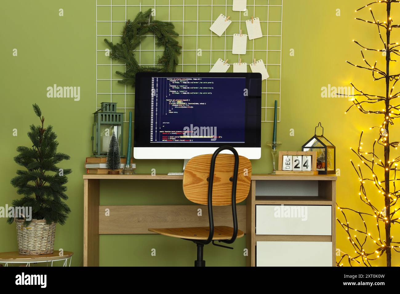 Interior of programmer's office with workplace, Christmas tree and ...