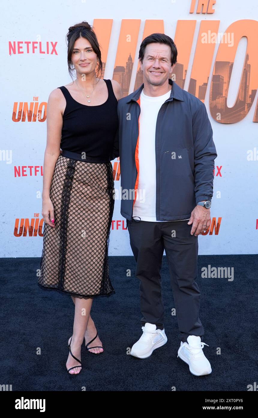 Mark Wahlberg and his wife Rhea Durham pose together at the premiere of