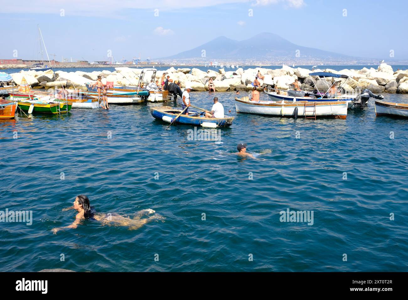 Locals cooling off in the sea off Santa Lucia, Naples, Italy Stock Photo