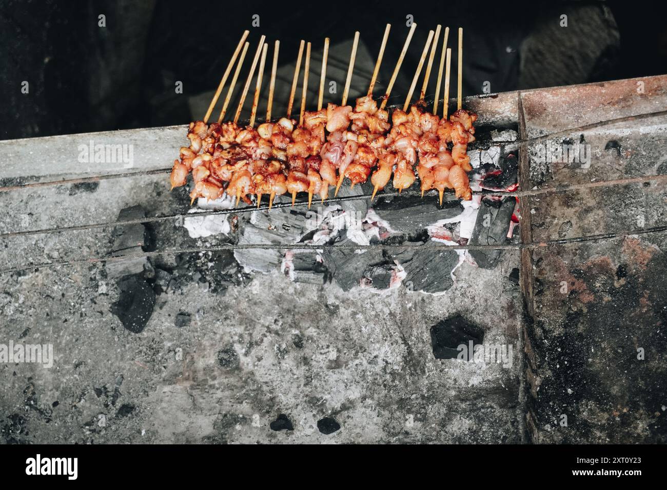 The process of making Indonesian chicken satay in traditional way using ...