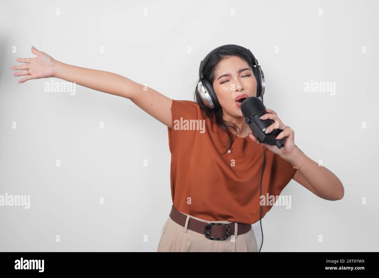 Excited woman dancing over white hi-res stock photography and images ...