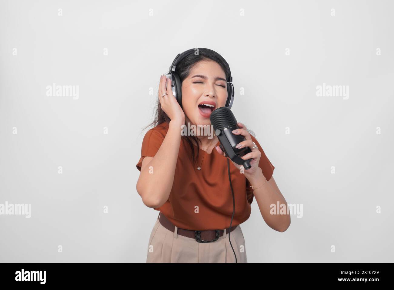 Excited woman dancing over white hi-res stock photography and images ...