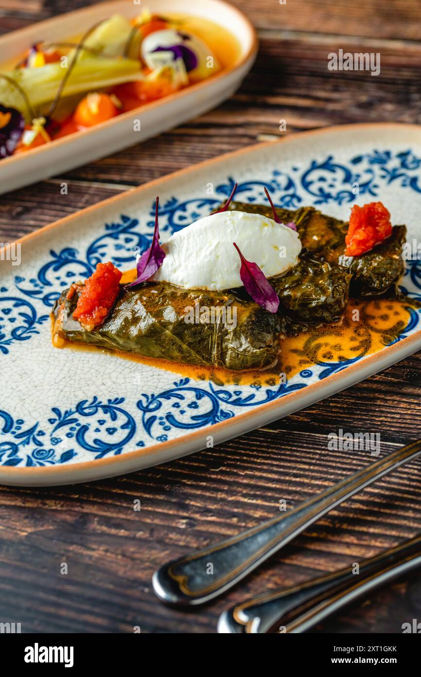 Turkish Dolma (sarma) stuffed vine leaves from Turkish traditional cuisine. Turkish name Yaprak Sarmasi Stock Photo