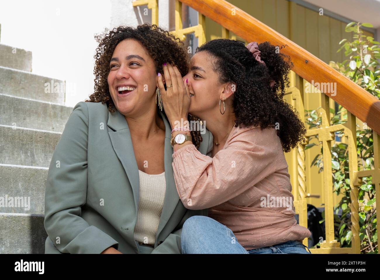 Whispering to each other hi-res stock photography and images - Alamy
