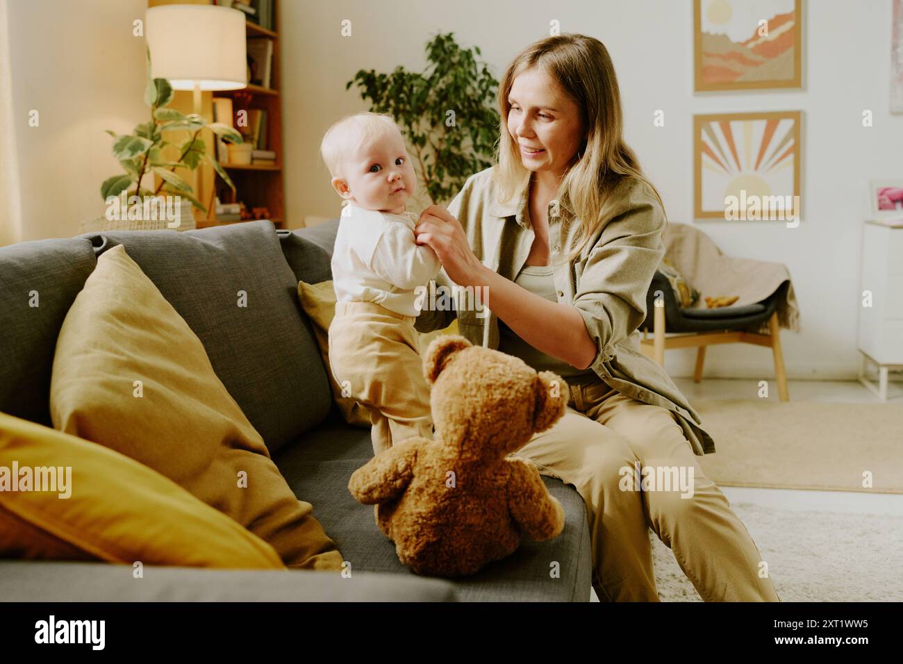 happy mother and child with teddy bear at home Stock Photo - Alamy