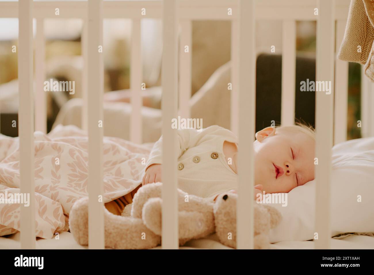 Infant sleeping in white crib hi-res stock photography and images - Alamy